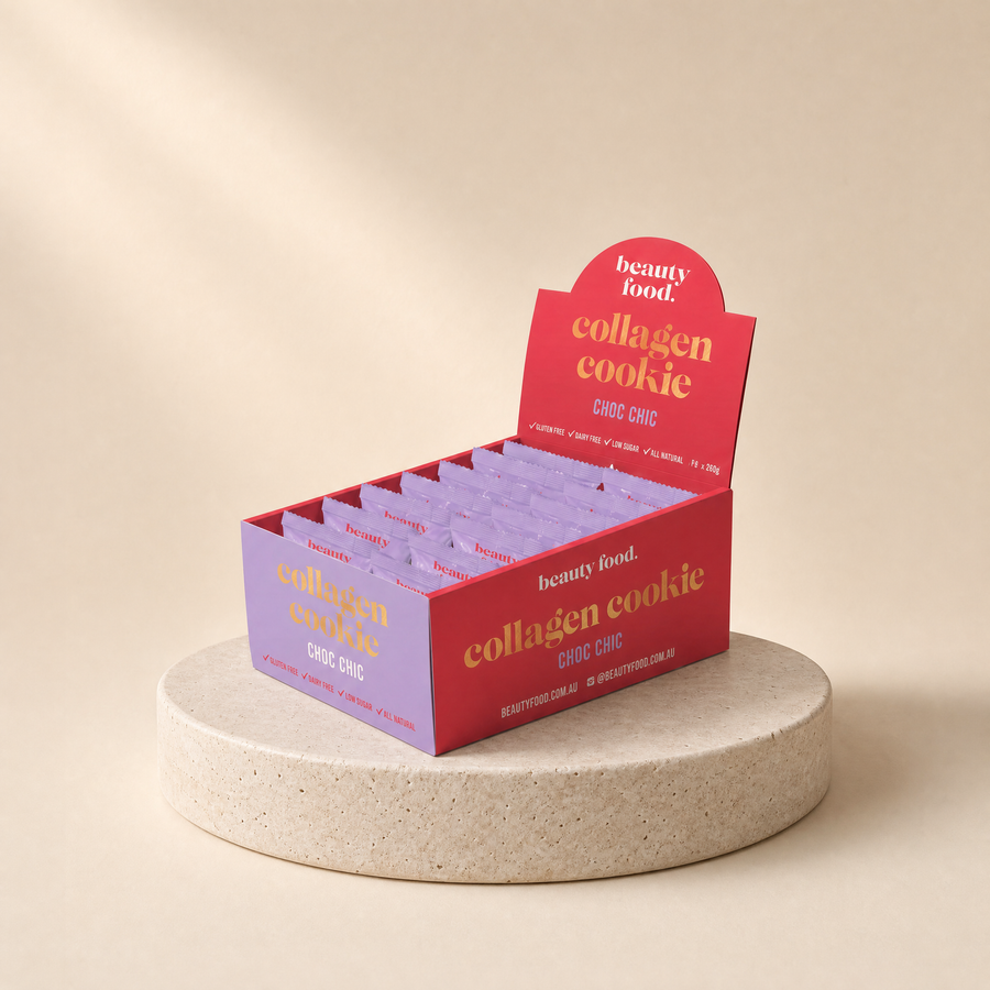 Collagen cookies (chocolate) on a beige stone platform