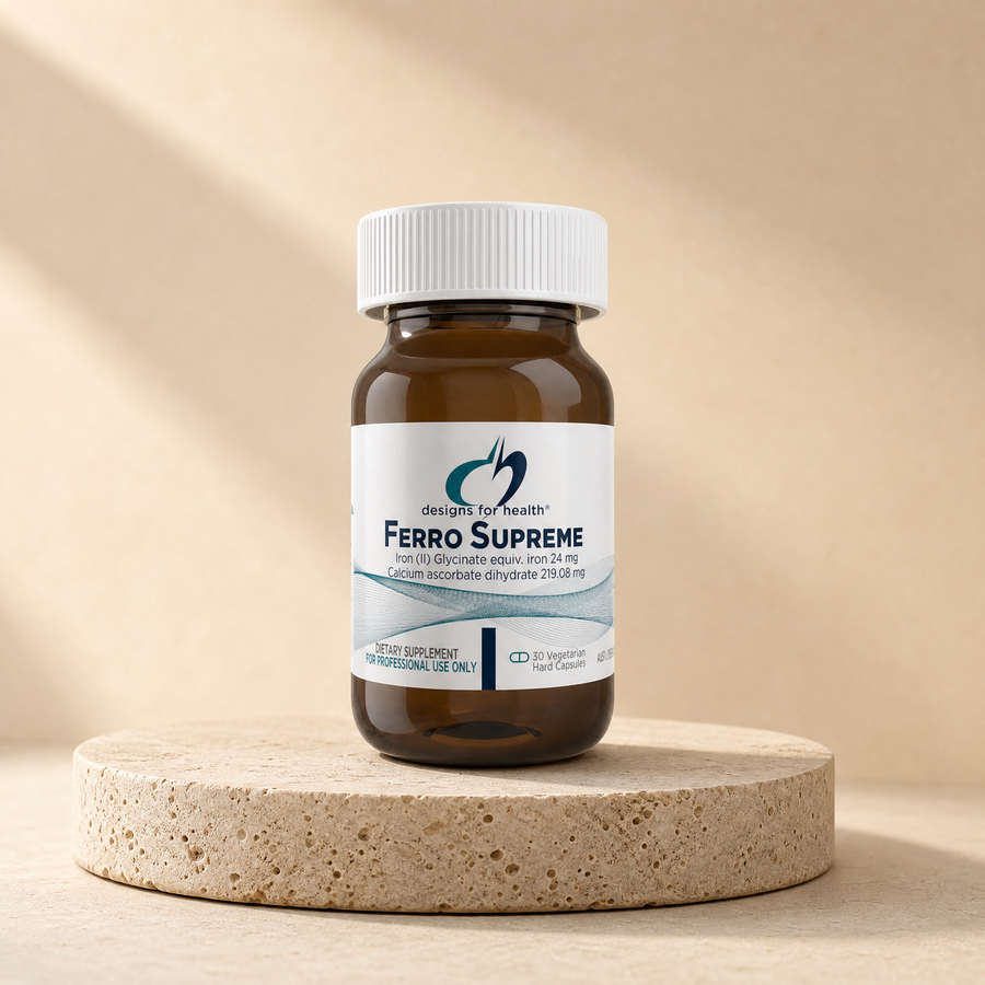 Designs for Health Ferro Supreme, iron 24 mg, calcium ascorbate 219.08 mg, 30 capsules on a beige stone platform