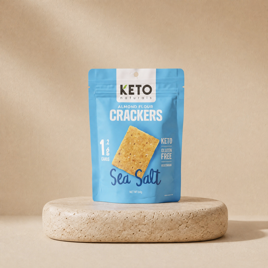 Almond flour crackers (sea salt) on a beige stone platform