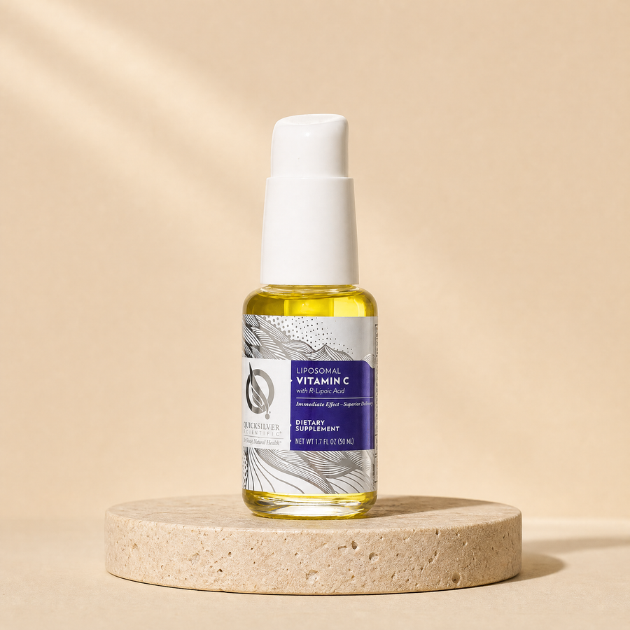 Quicksilver Scientific Liposomal Vitamin C, 50 mL on a beige stone platform