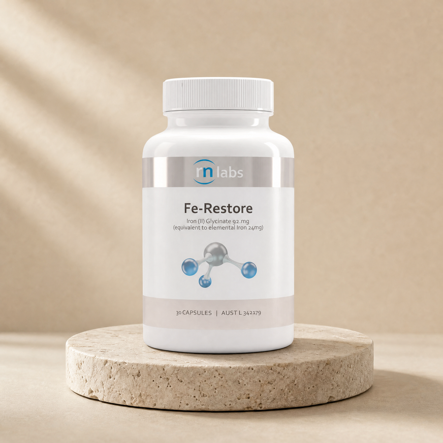 RN Labs Fe-Restore, 30 capsules; iron glycinate 92.1 mg equivalent iron 24 mg; brand, count and bottle match source on a beige stone platform