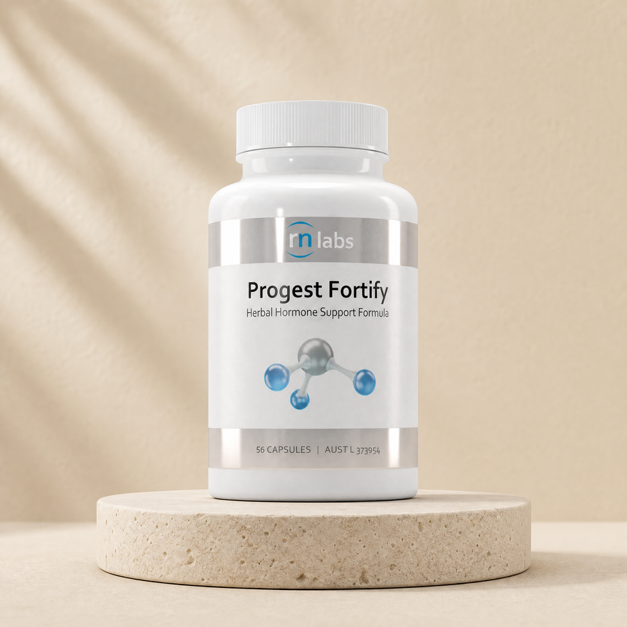 RN Labs Progest Fortify herbal hormone support formula, 56 capsules on a beige stone platform